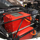 The battery box as it looks today, complete with the custom “Nap Moto” strut tower bar that runs over it.
